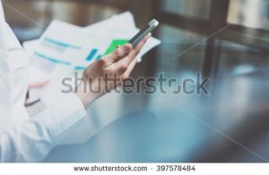stock-photo-photo-young-businesswoman-working-new-startup-project-office-contemporary-smartphone-holding-female-397578484